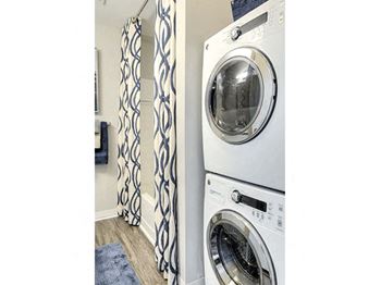 Stackable washer and dryer in each apartment at The Villas at Northstar, Ann Arbor